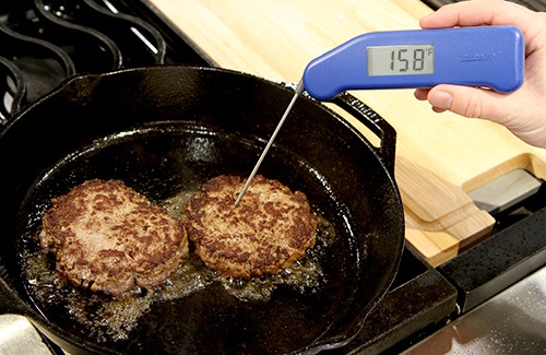 Measuring temperature of burgers on cast iron