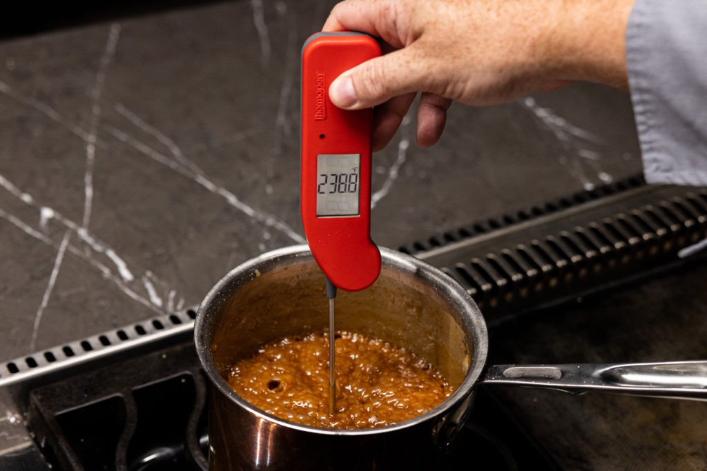temping the caramel with a Thermapen ONE