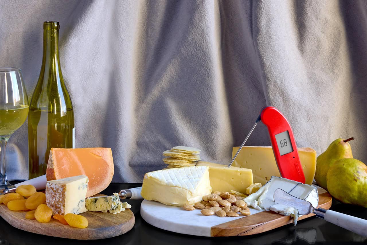 Cheese, charcuterie, wine, thermometer still life