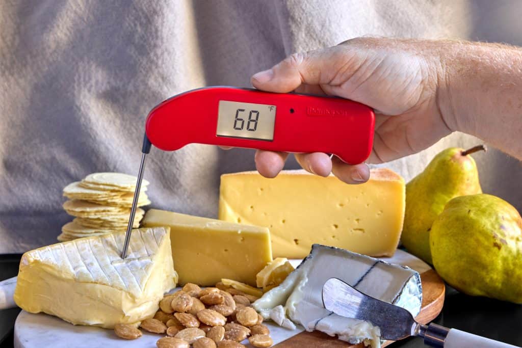 temping a wedge of cheese on a charcuterie board