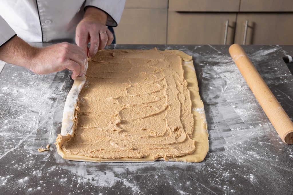 rolling up the dough and filling