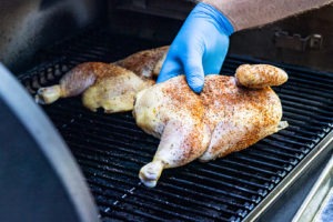 Placing chicken in the smoker