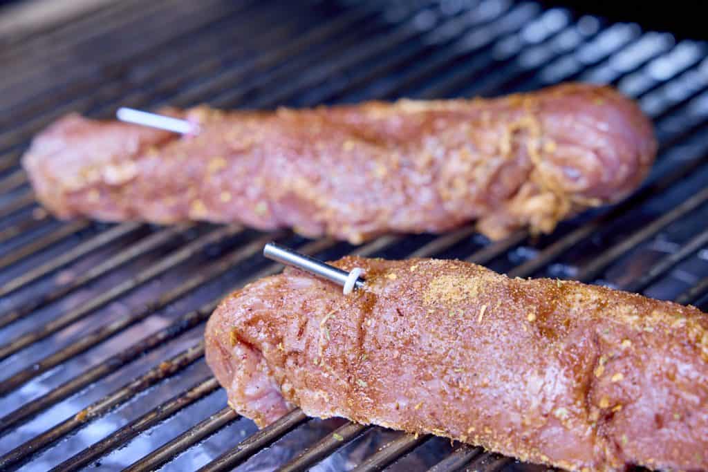 tenderloins with probes in them on the smoker