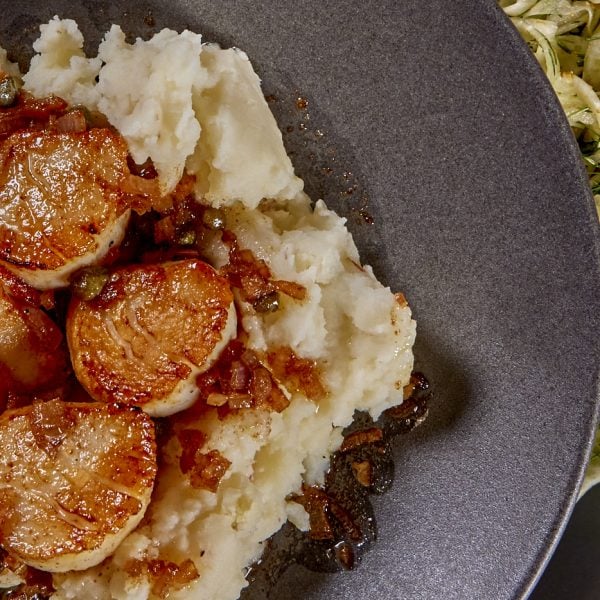 A plate of scallops with sides