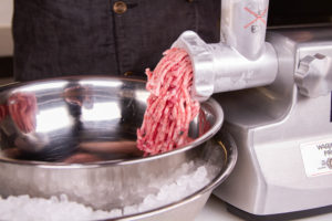 Grind the meat into a bowl set in ice for best bratwurst