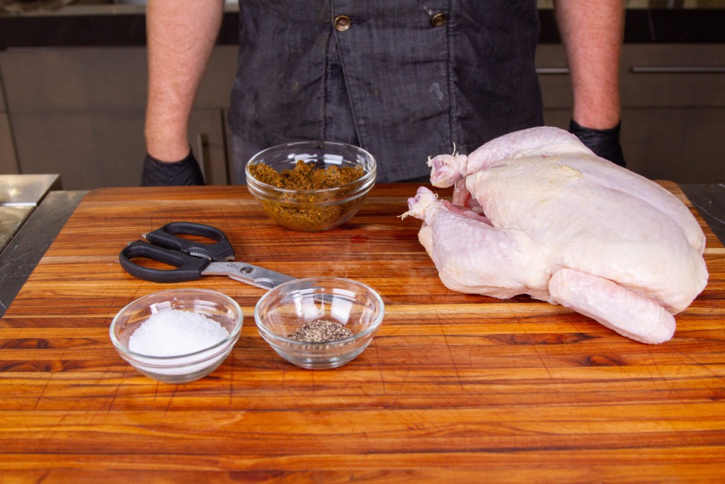 Simple ingredients for whole grilled chicken
