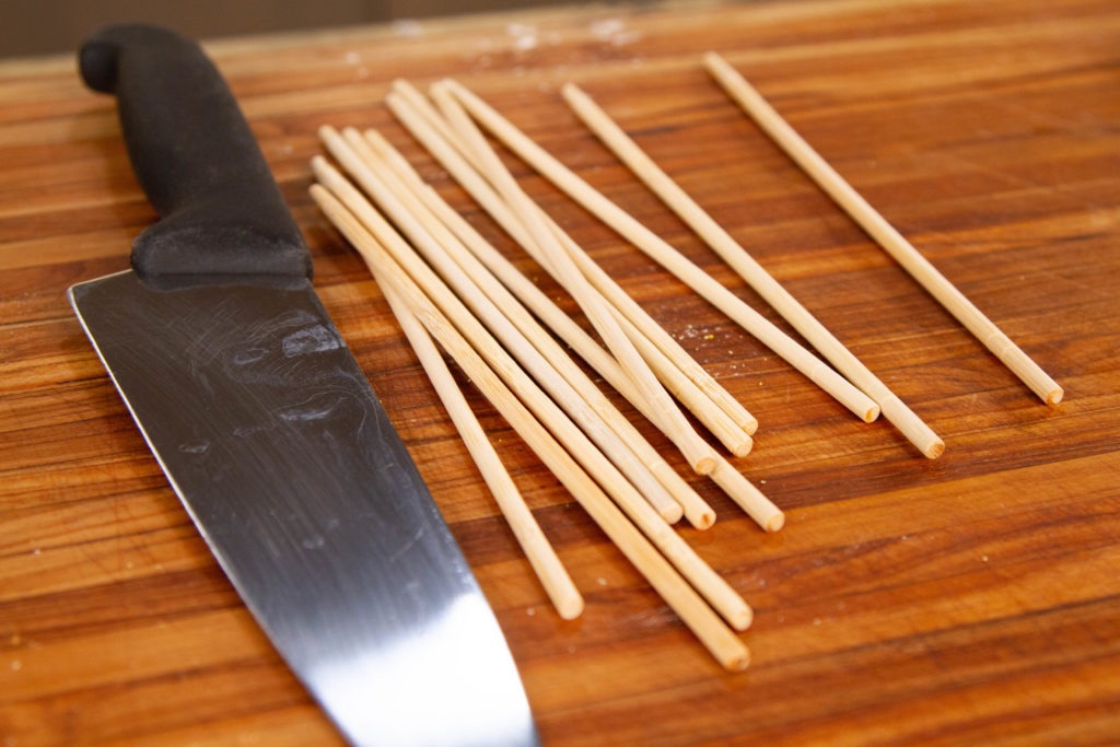 Disposable bamboo chopsticks are a great way to skewer your corn dogs, if cut to the proper length. 