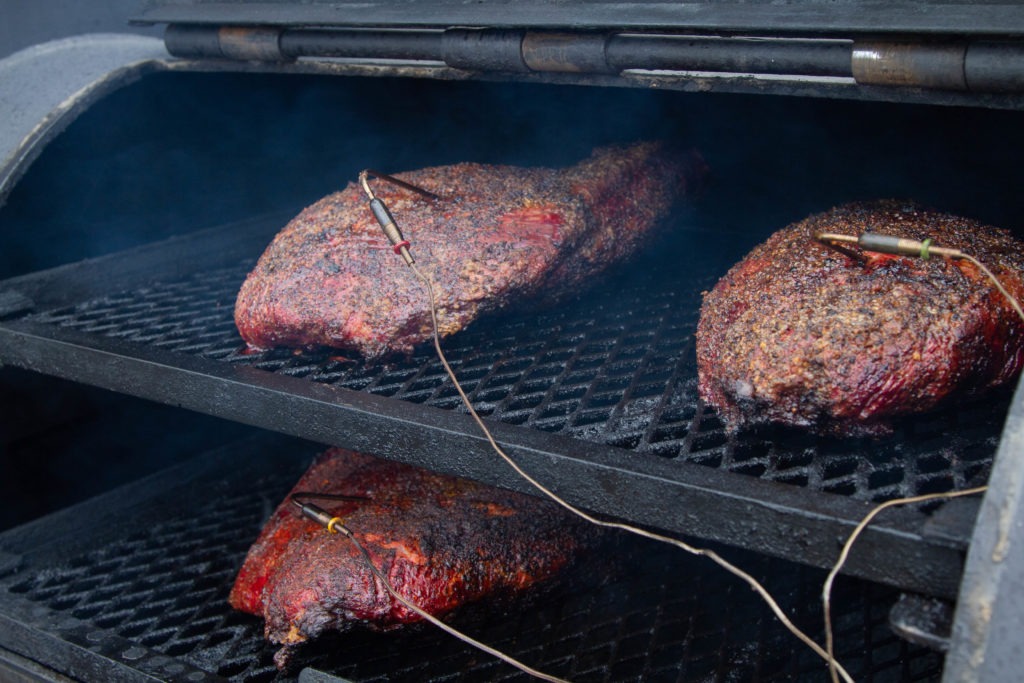 A large drum smoker with brisket flats