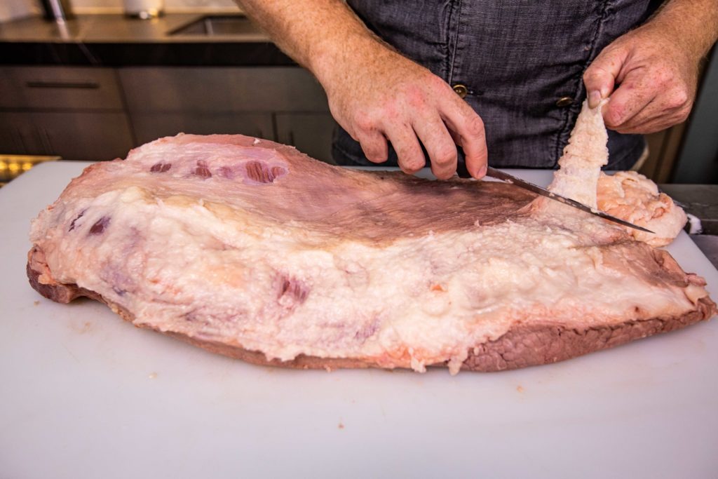 Trim the excess fat from the brisket