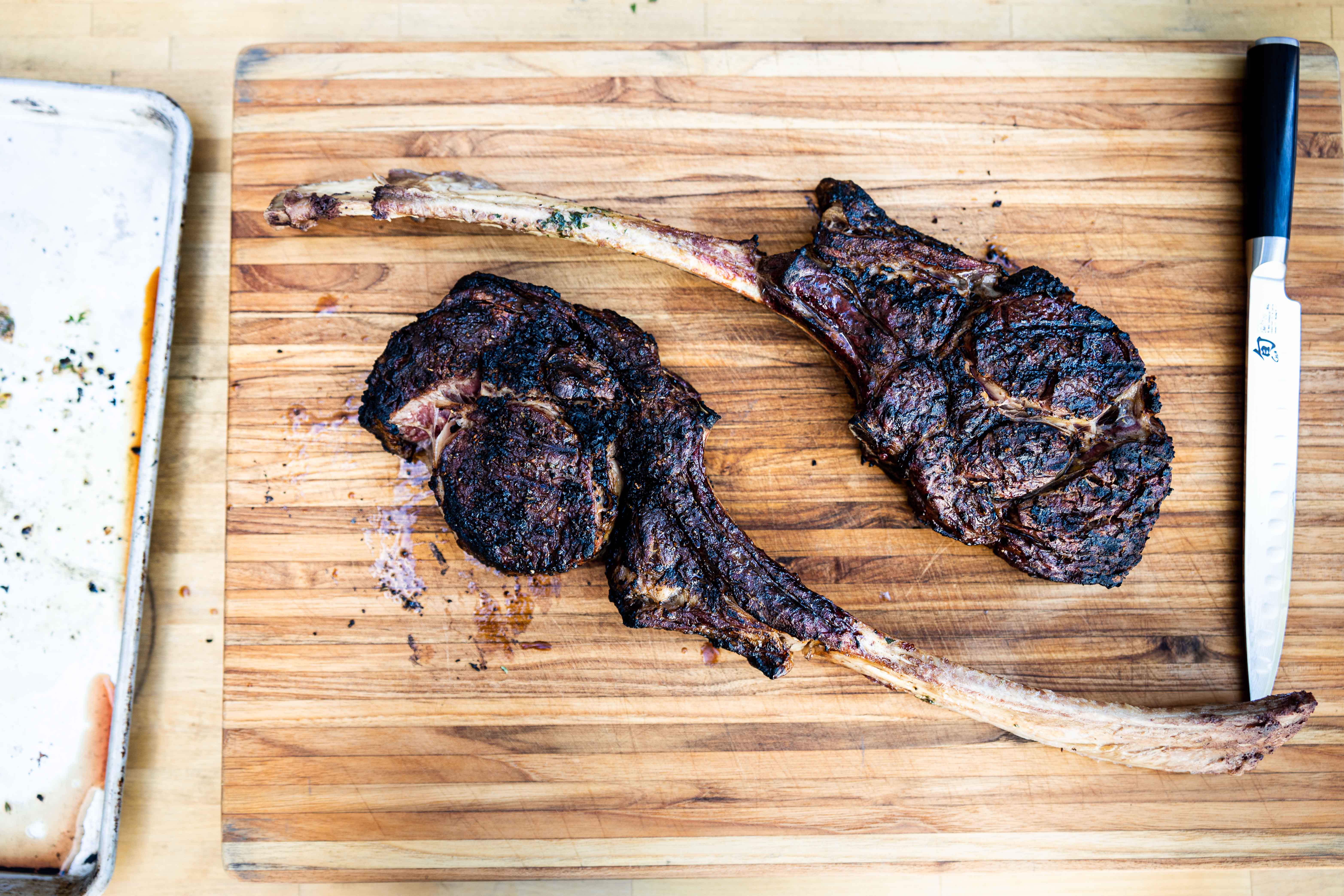 Two grilled tomahawk steaks