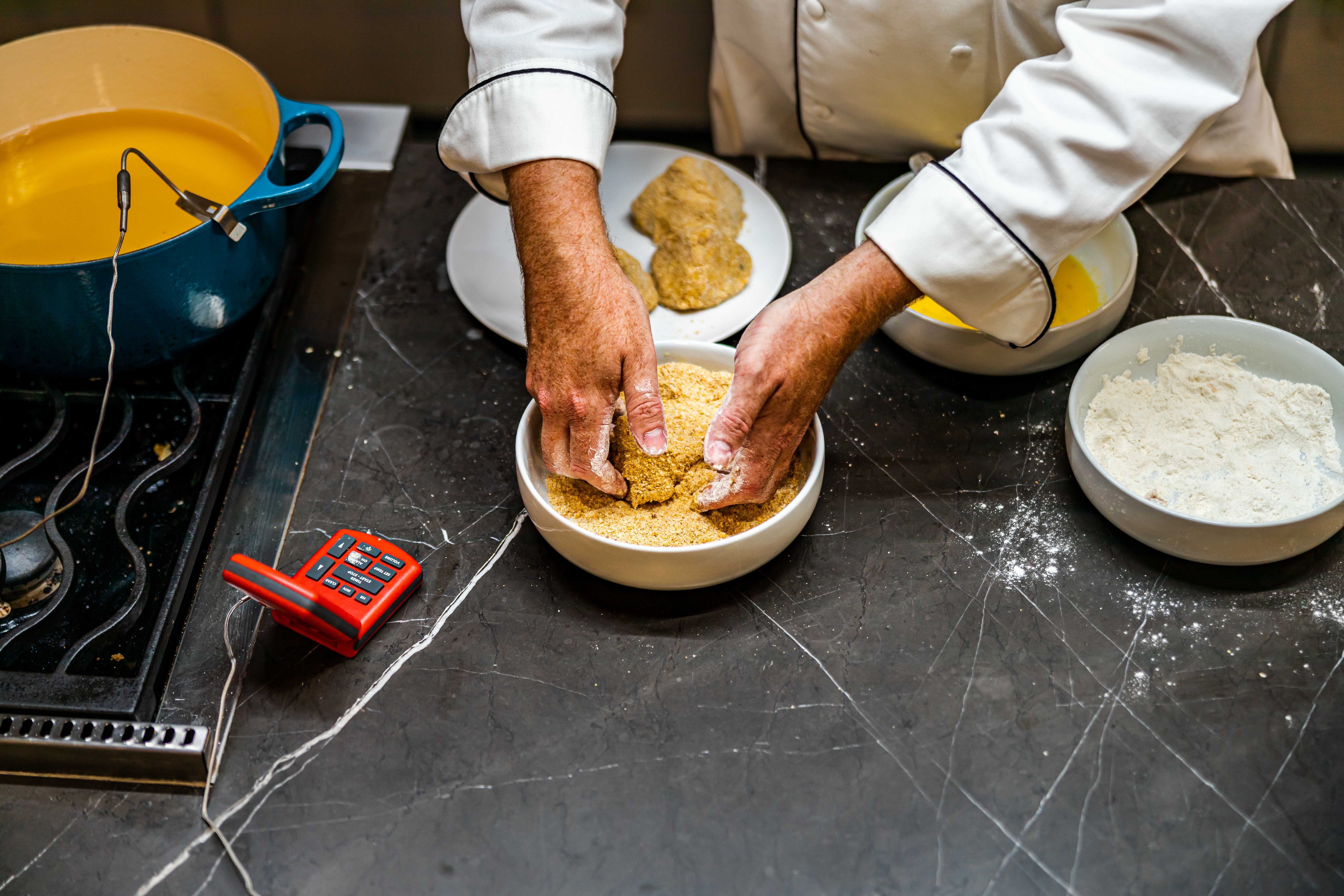 Coating the croquette in breadcrumbs