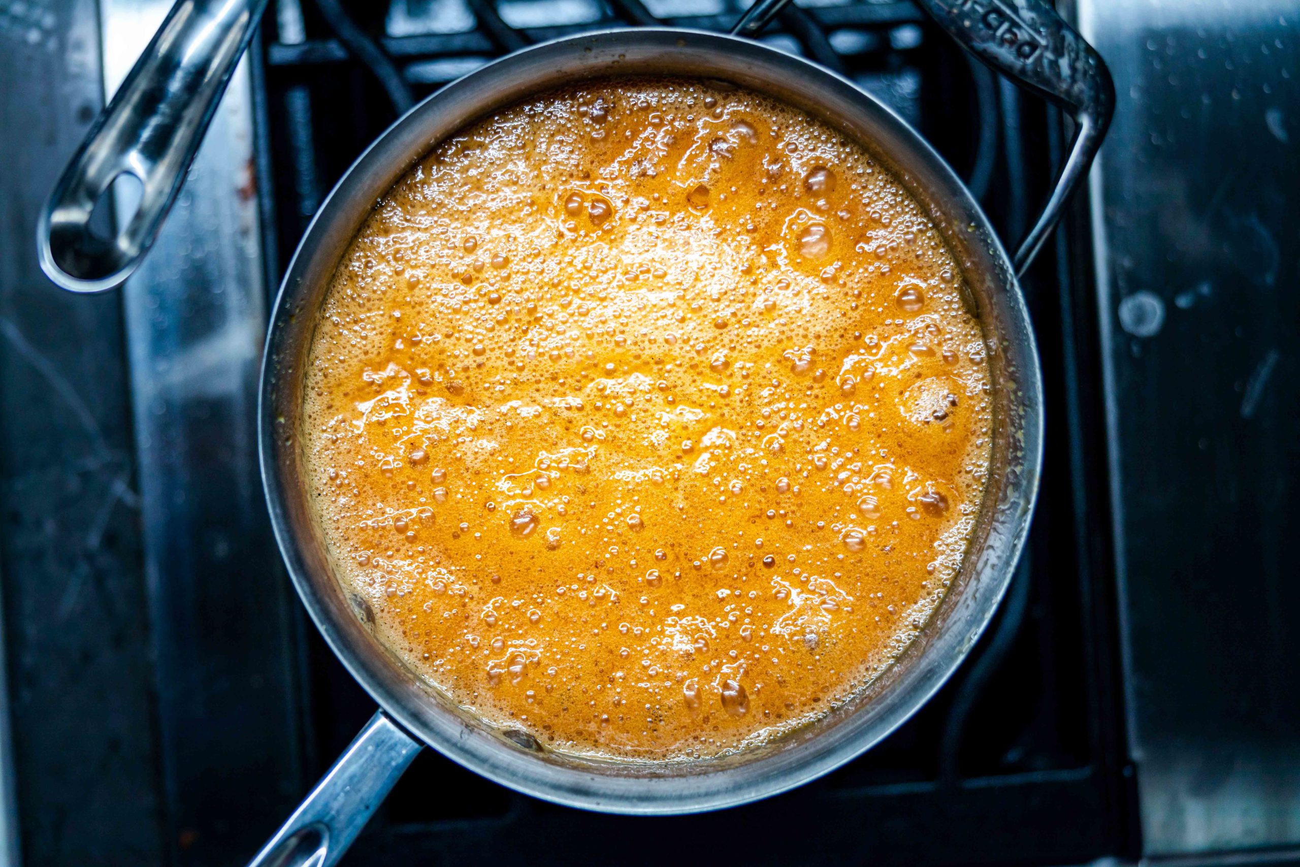 Foamy caramel in a saucepan