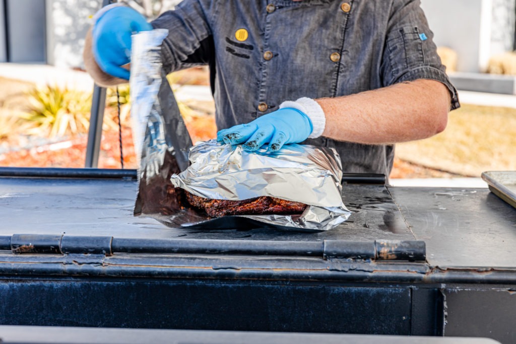 Wrapping a pork butt in aluminum foil
