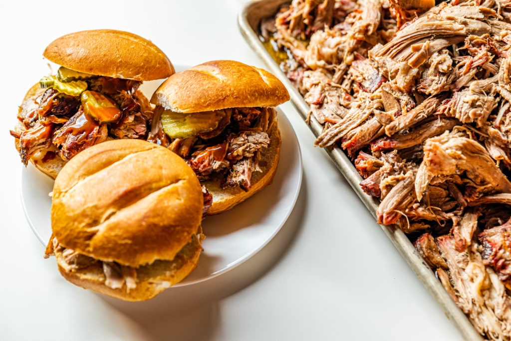 Loads of pulled pork and some pulled  pork sandwiches