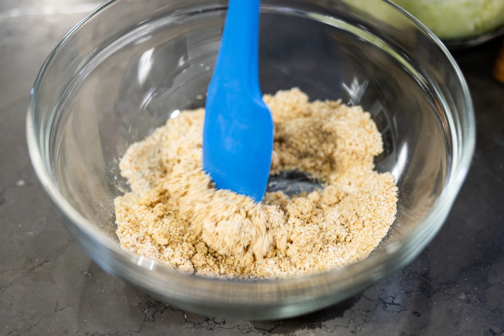 Mixing milk and breadcrumbs for a binder