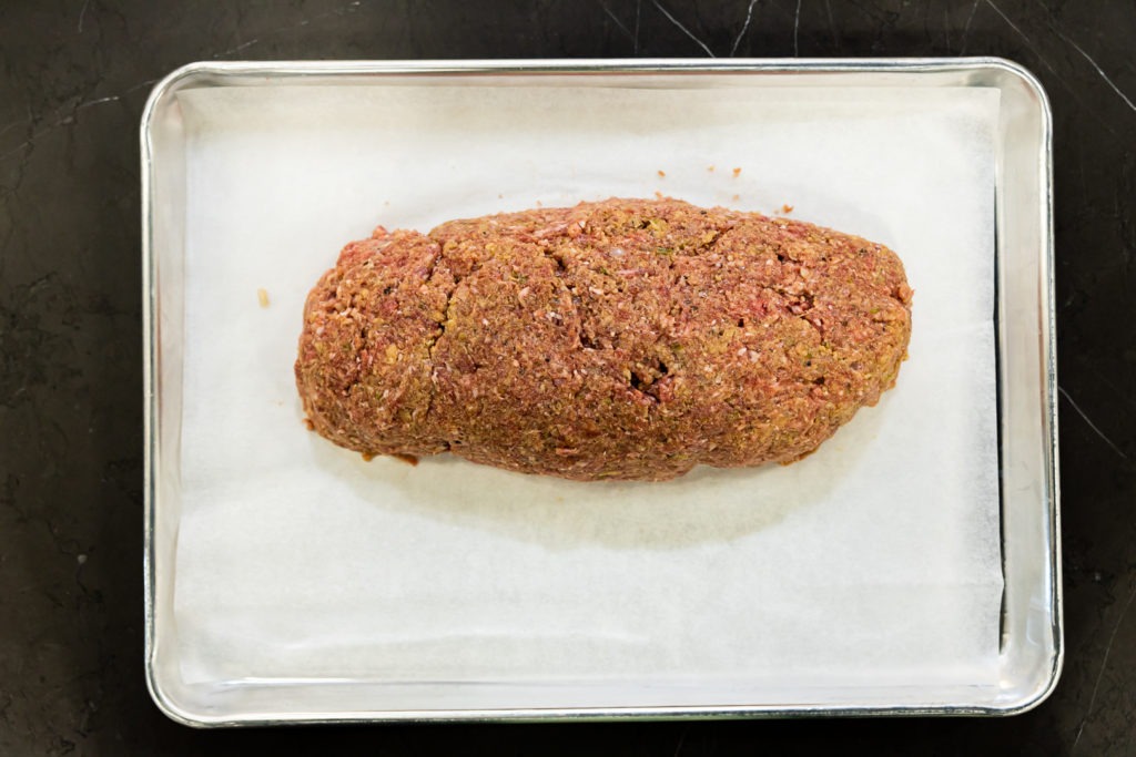 Free-formed meatloaf on a sheet tray