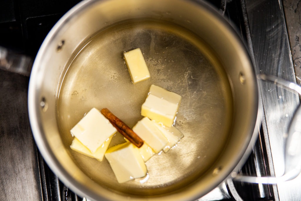 Bringing the water to a boil with the butter and cinnamon and vanilla