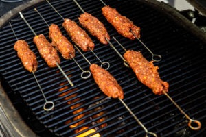 Raw kebabs on the grill