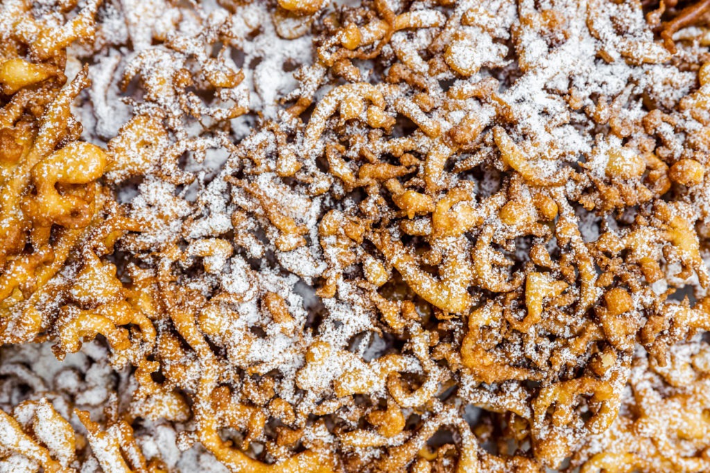 A close up of a tangle of funnel cakes