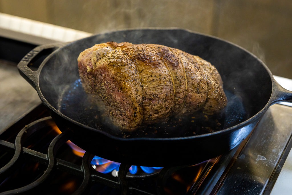 Saearing the roast in a pan