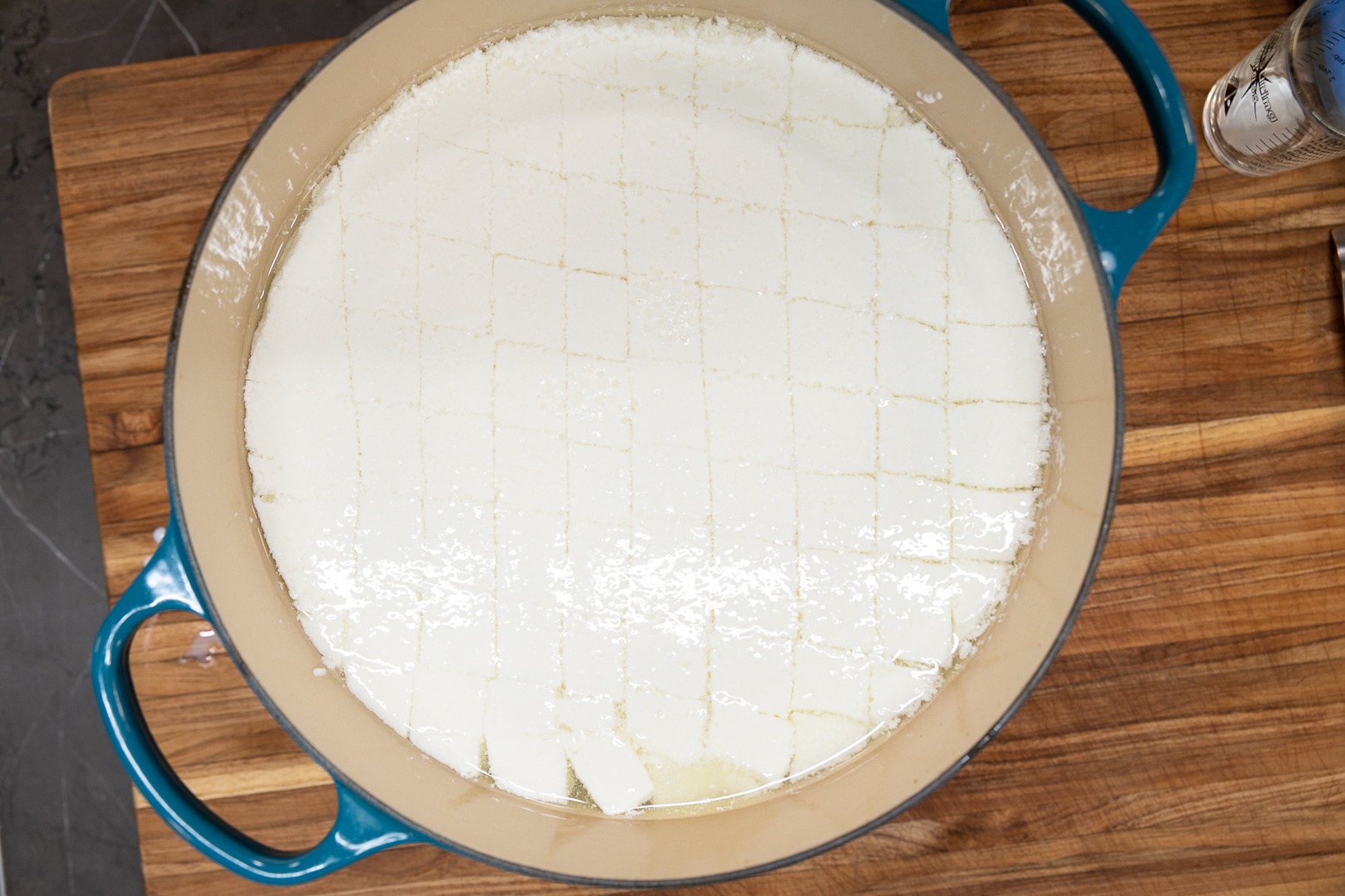 The cut curds in the pot, unstirred