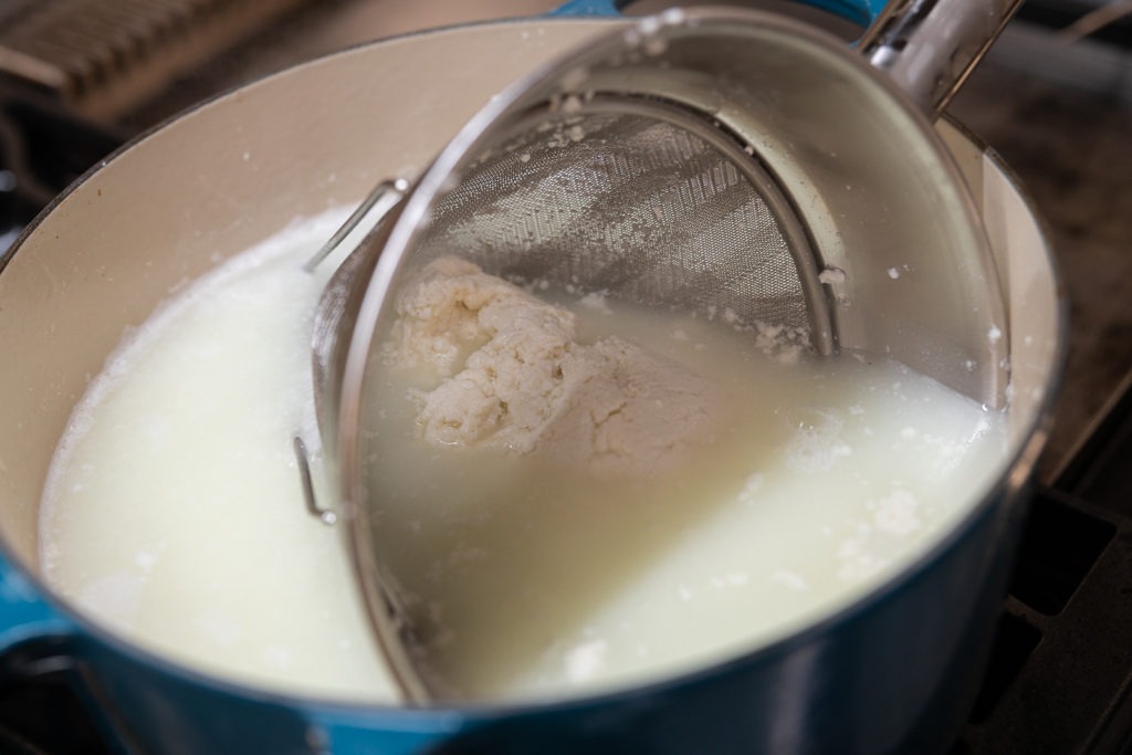 Bathing the curd in hot whey