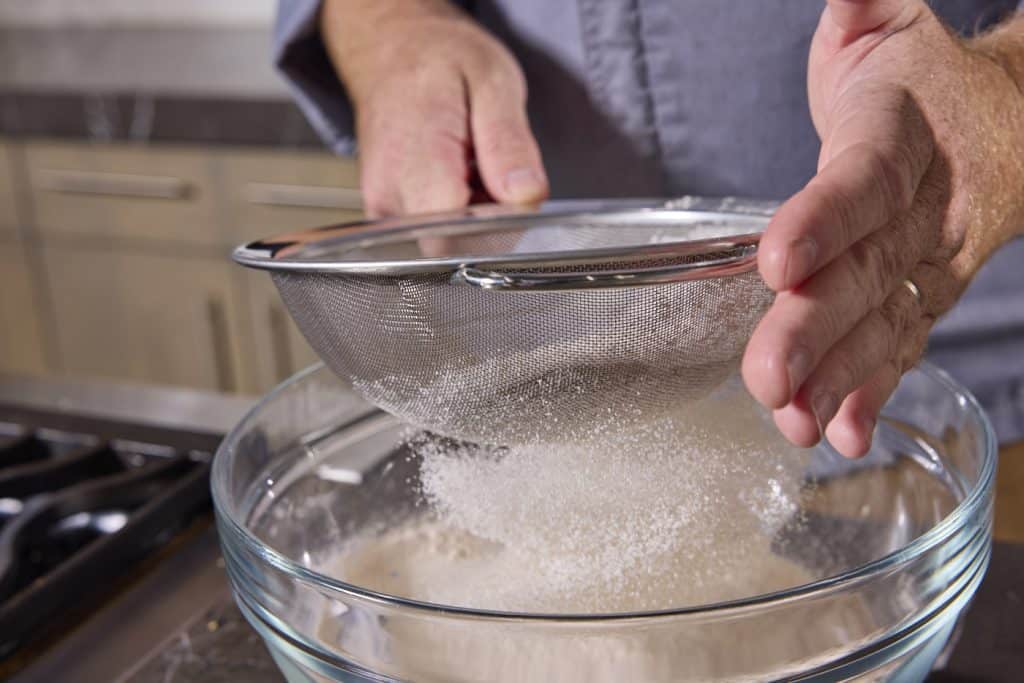 sifting the flour and spices