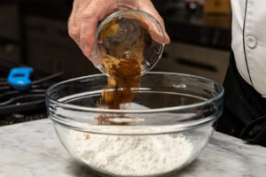 Adding the spices to the flour
