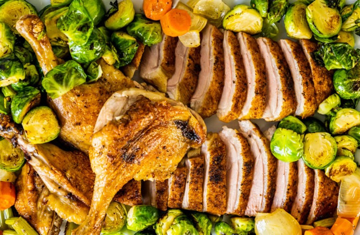 Platter of roast duck and vegetables