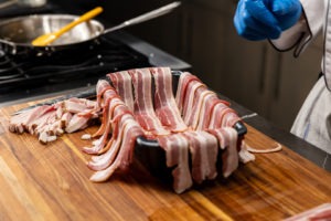 lining the pan with bacon