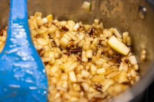 Mixing apples, sugar, and starch