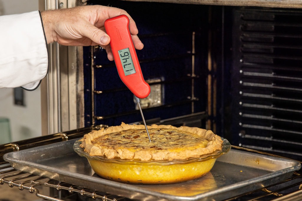 Temping the quiche with a Thermapen