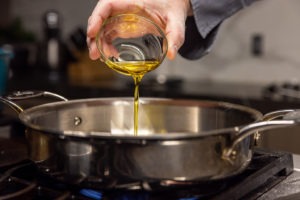 Putting oil in the pan
