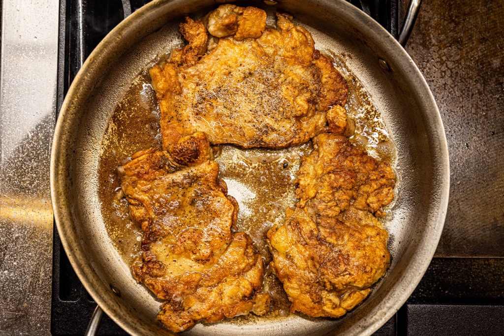 Browned chicken in a pan