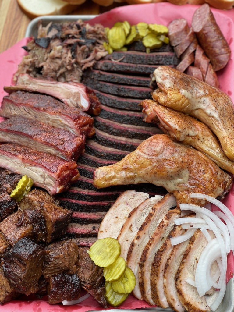 A tray of many BBQ meats