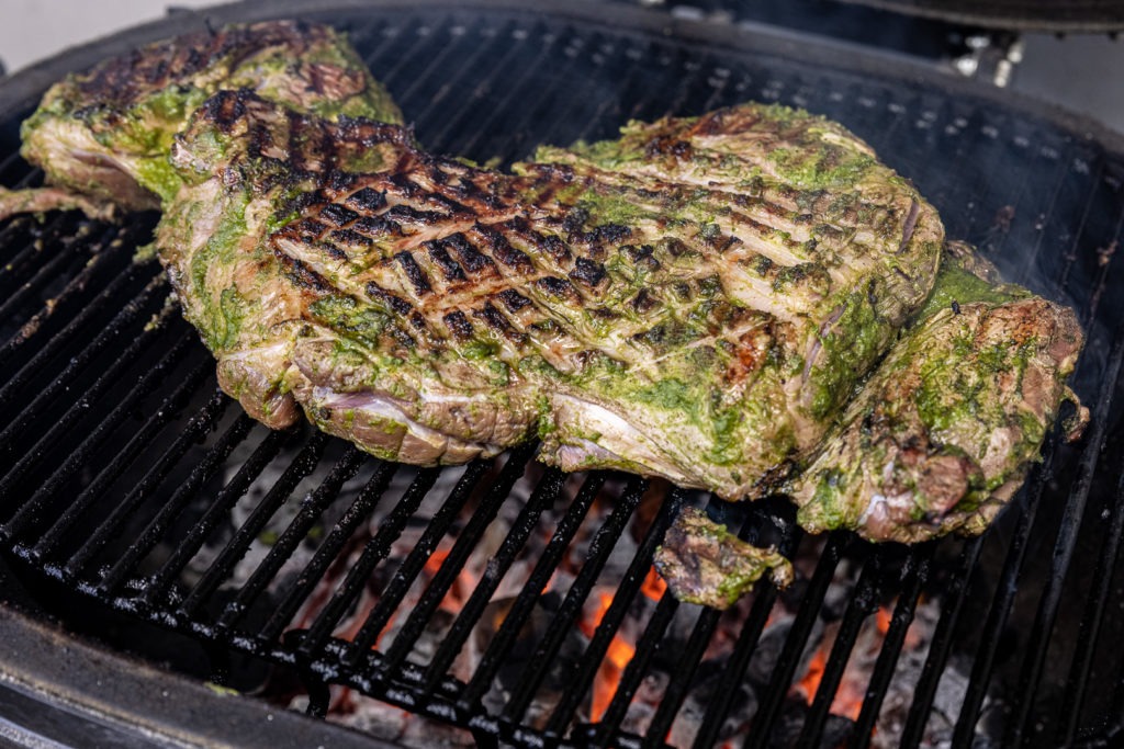 Beautifully browned leg of lamb on the grill