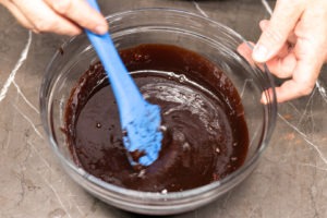 mixing the hot custard with the chocolate