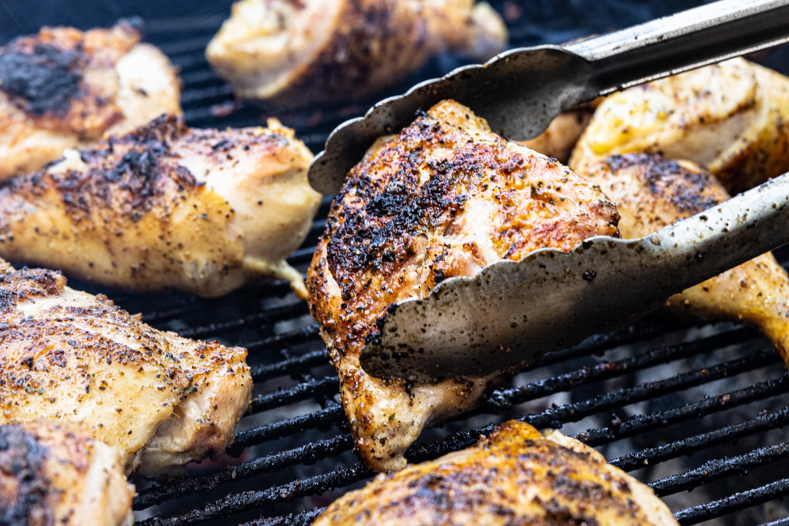 Turning chicken on the grill