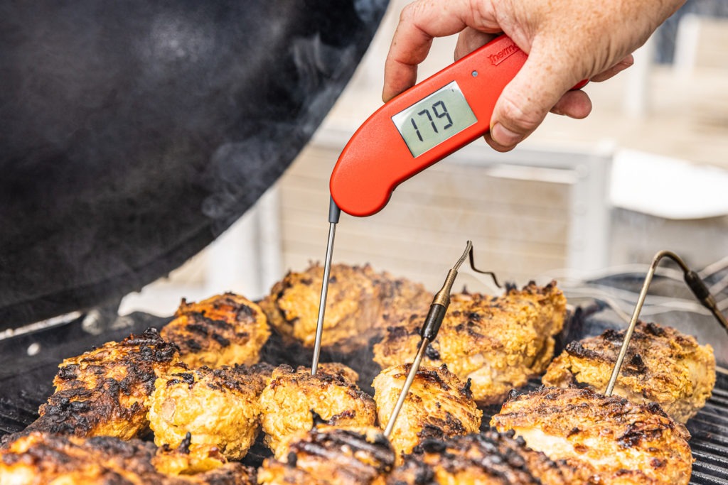 Temping the grilled fried chicken