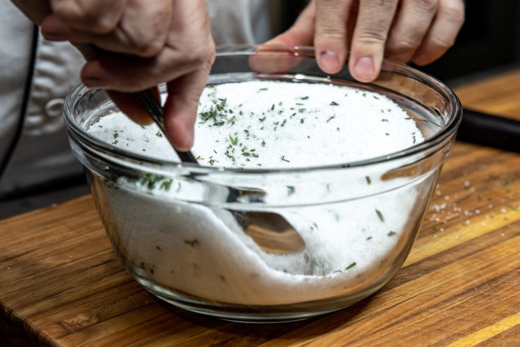 Mixing herbs with salt