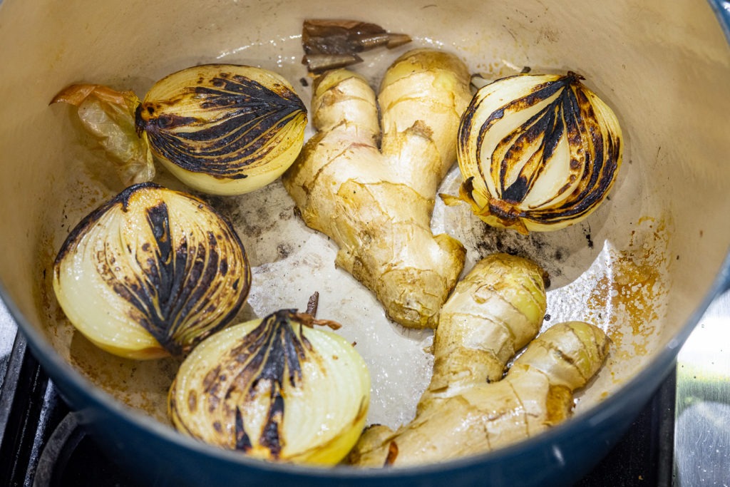 Charred onions and ginger in the pot