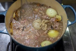 Stirring the meat paste into the broth