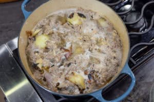 the broth simmering through the raft