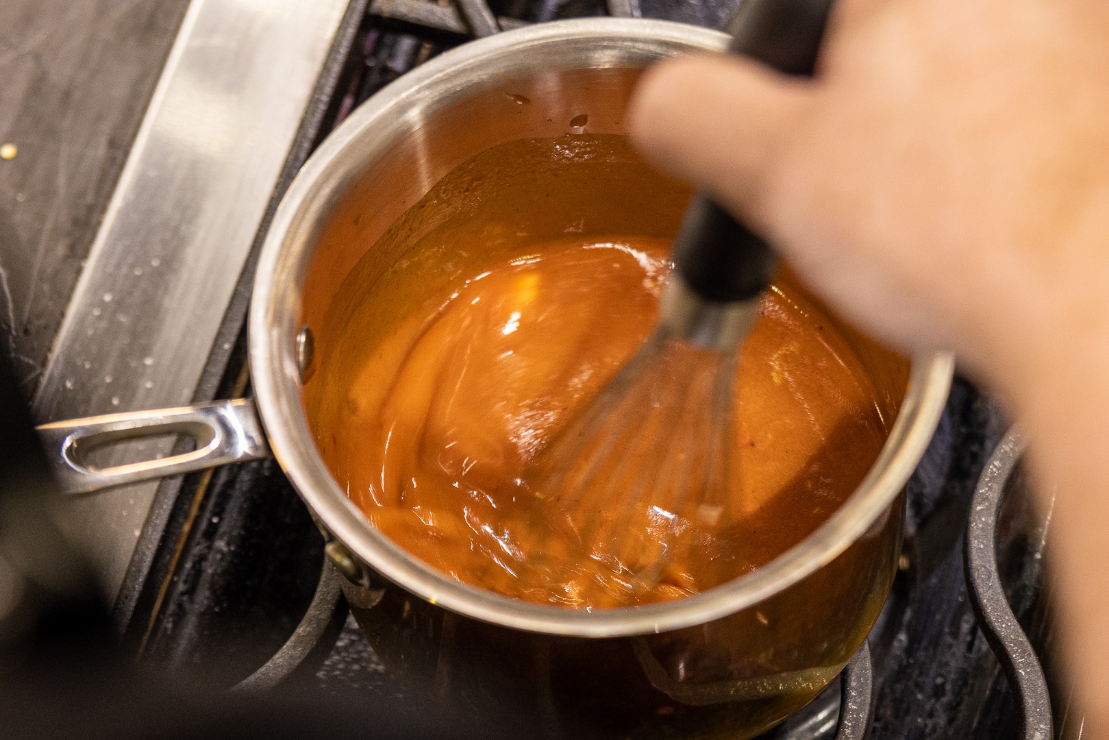 whisking the sauce