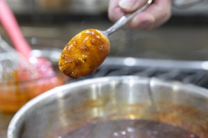 The sauce coating the back of a spoon