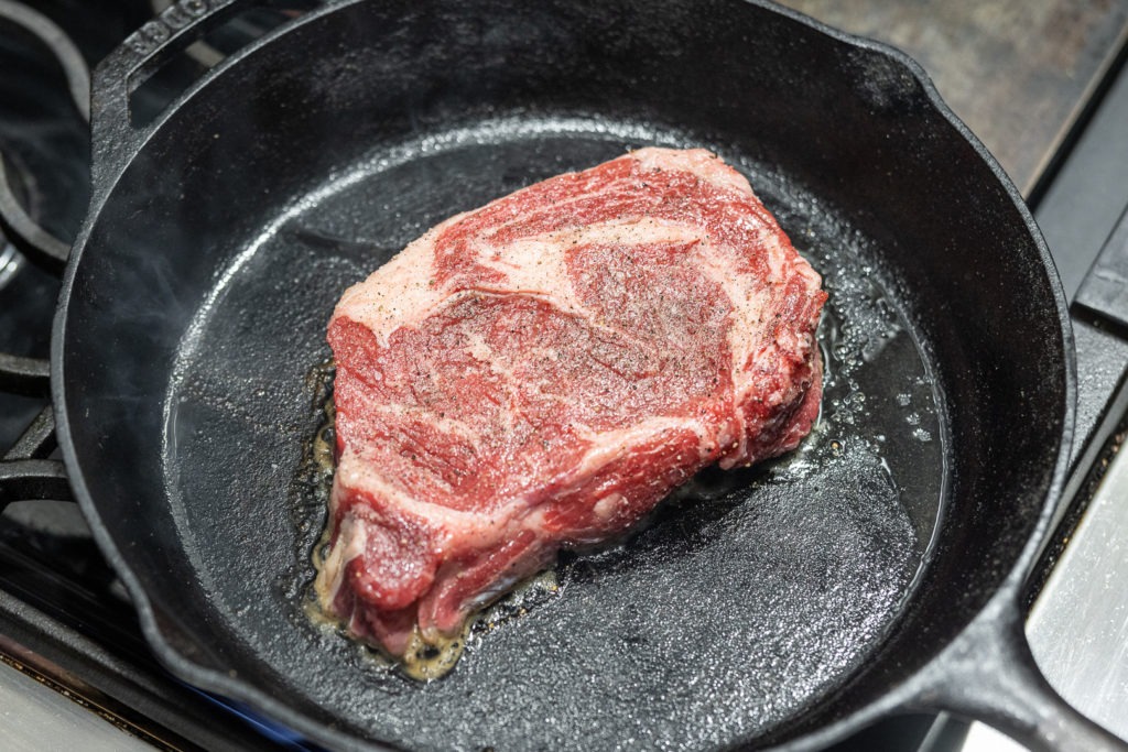 Searing a ribeye steak