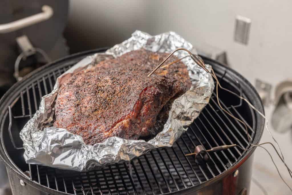 the brisket in its boat with probes