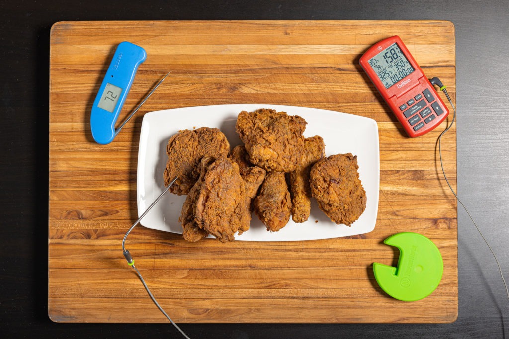 Crispy, golden fried chicken with thermometers