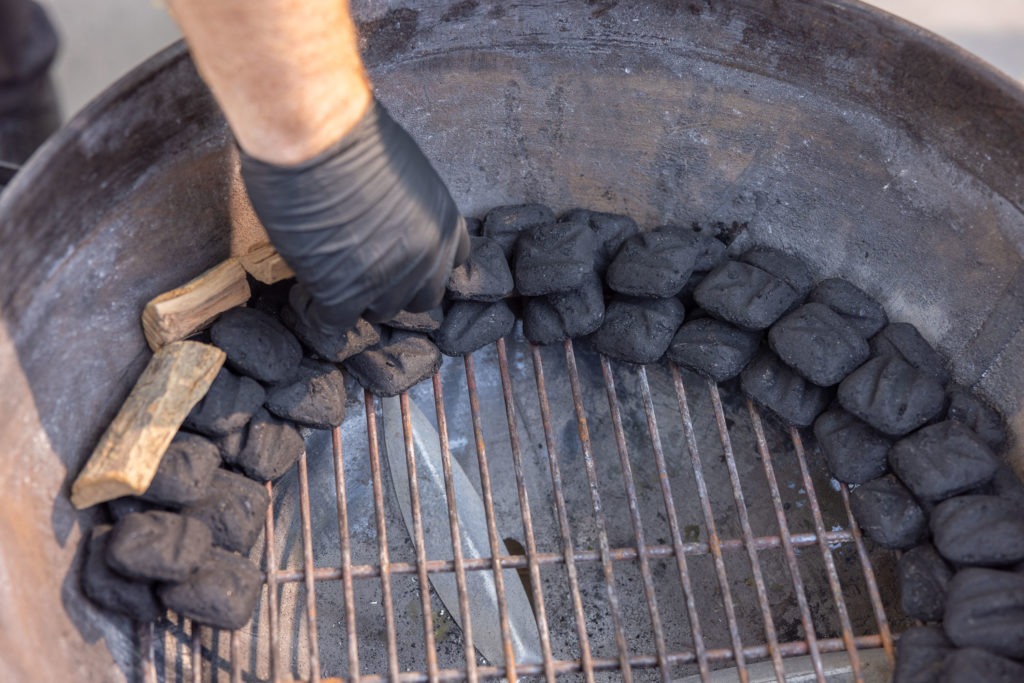 Making the charcoal snake in the kettle