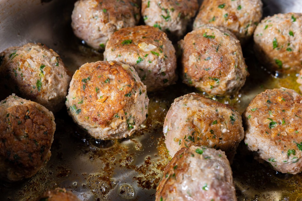 turkey meatballs browning in the pan